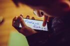 shallow focus photo of person using smartphone