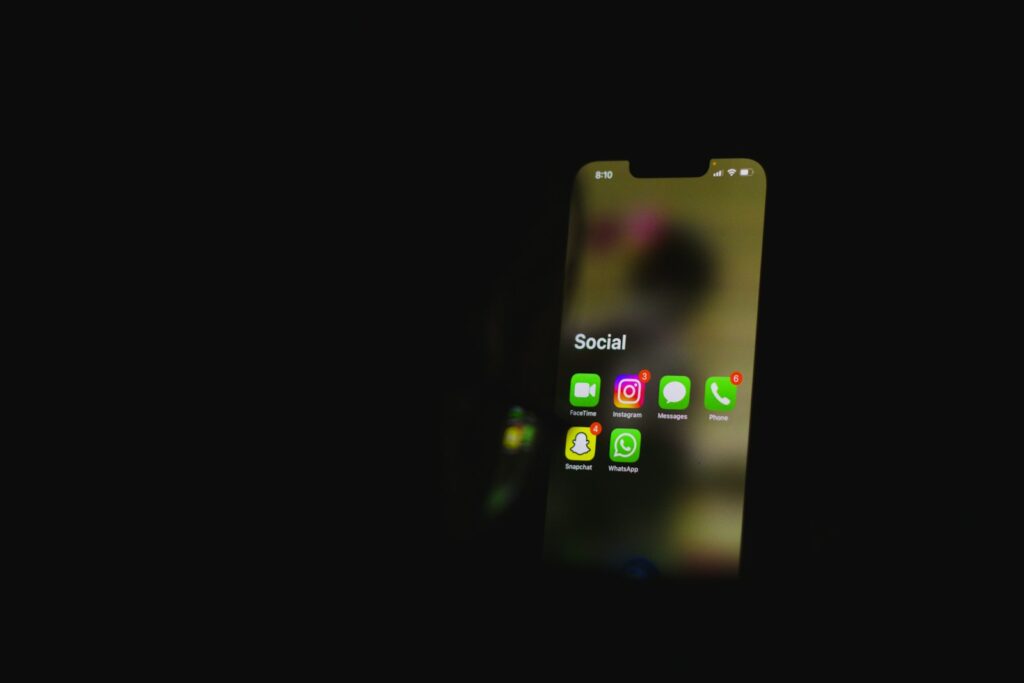 a close up of a cell phone in the dark